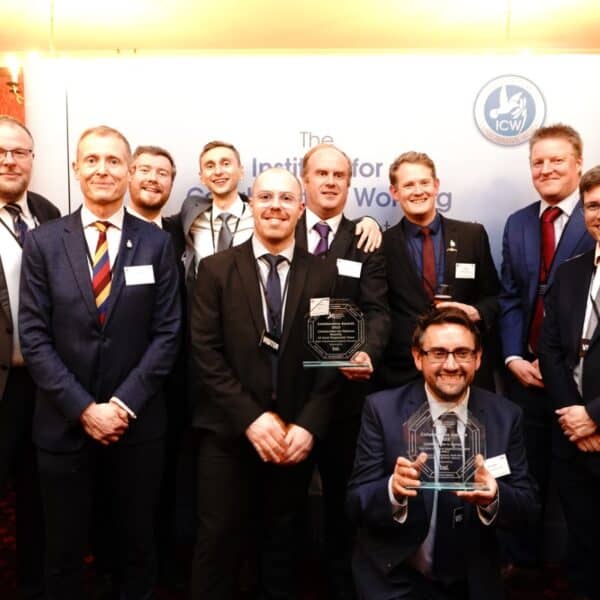 Group photo of the teams with their trophies at the Institute of Collaborative Working Awards