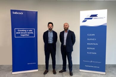 Representatives from Babcock and Franmarine standing in front of company banners