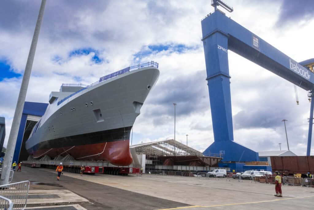 HMS Venturer rolls onto hardstand with Goliath Crane in the background