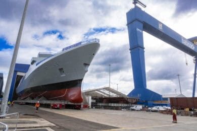 HMS Venturer rolls onto hardstand with Goliath Crane in the background