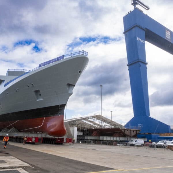 HMS Venturer rolls onto hardstand with Goliath Crane in the background