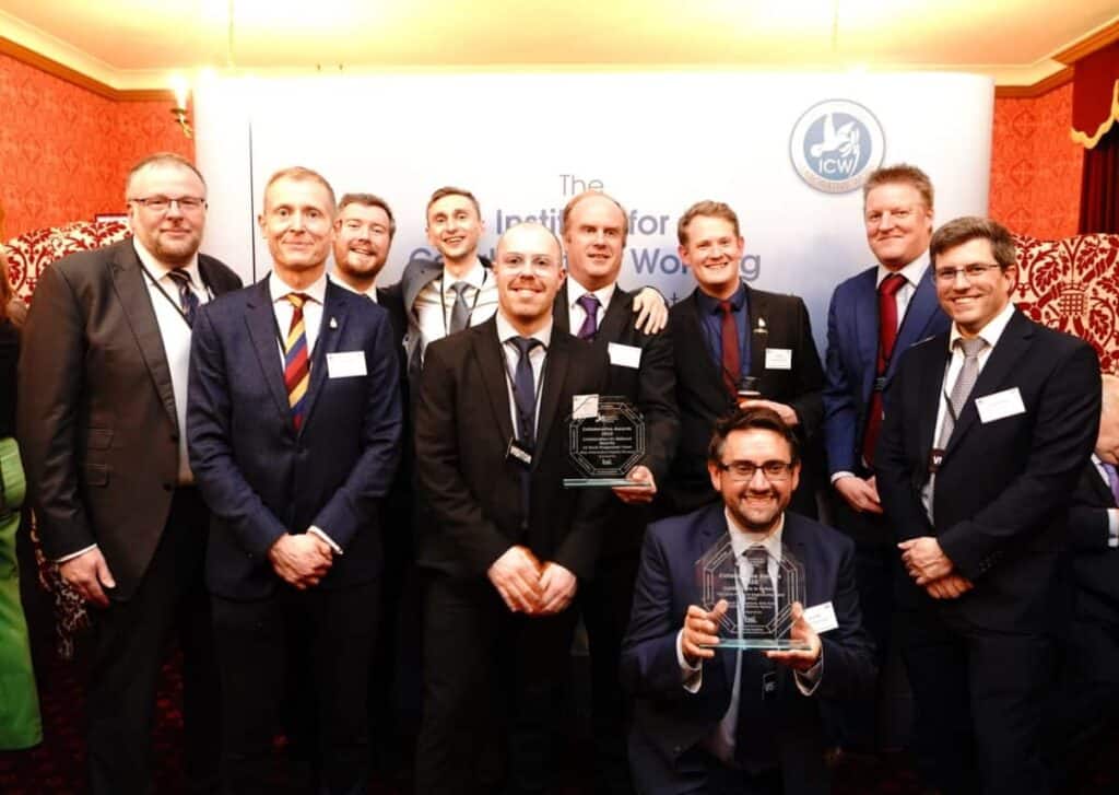 Group photo of the teams with their trophies at the Institute of Collaborative Working Awards