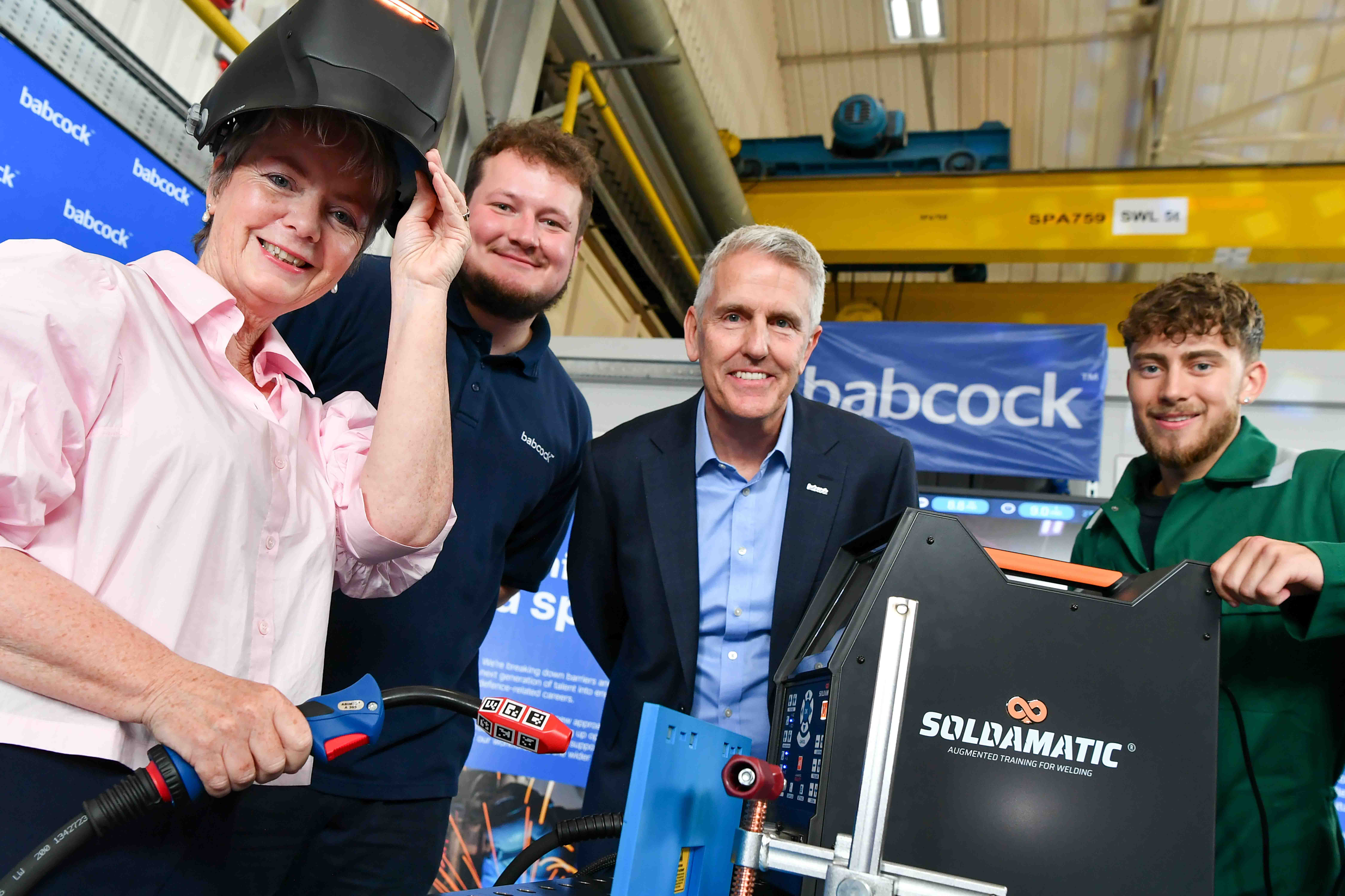 Karen Smith MP and Neil Misell of Babcock with welding apprentices