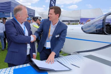 Representatives from Babcock and AURA AERO shaking hands over signed memorandum of understanding