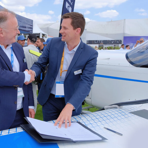 Representatives from Babcock and AURA AERO shaking hands over signed memorandum of understanding