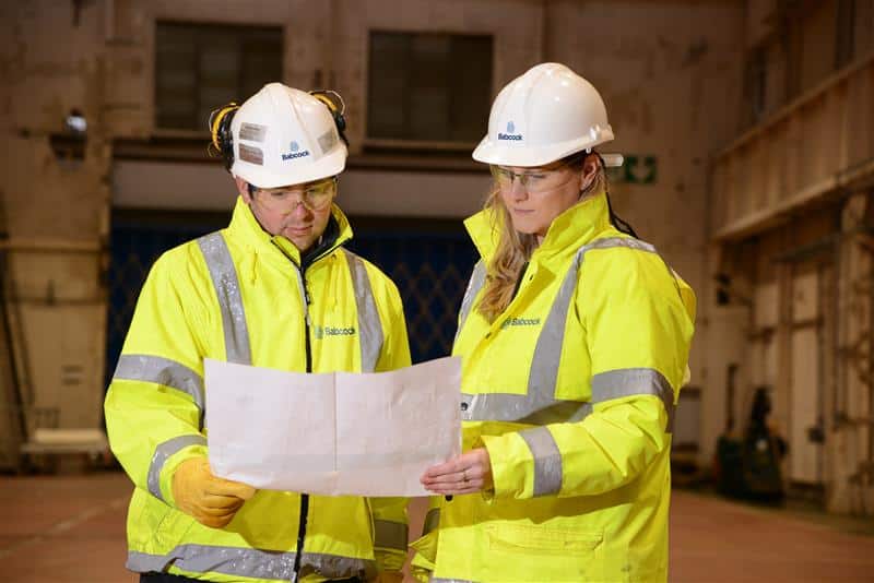 Babcock hi-vis safety Two babcock employees in hi-vis ensuring safety and wellbeing